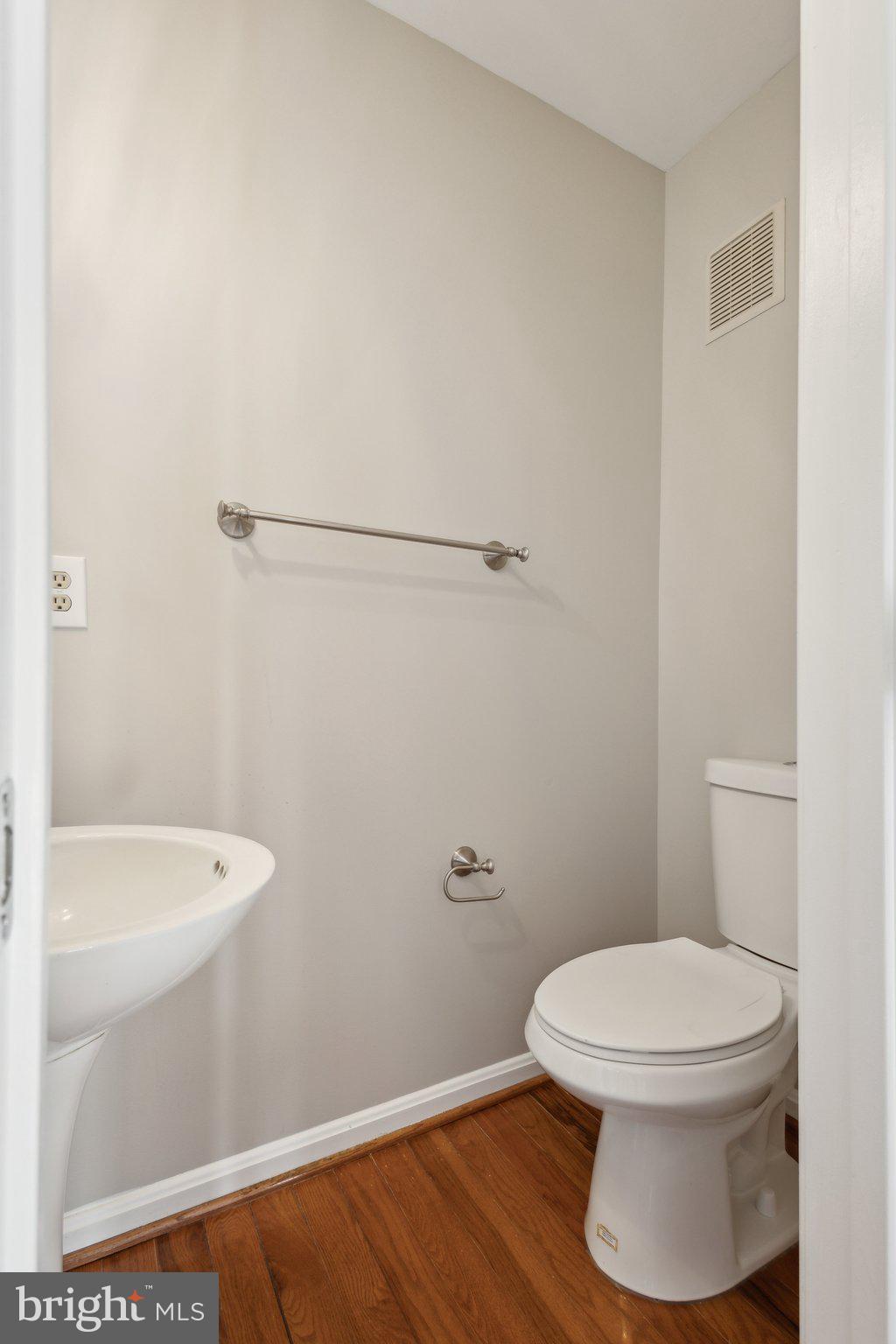 8802 Eagle Rock Lane Springfield, VA 22153 - Photo 4 of 18 a white toilet sitting next to a bathroom sink