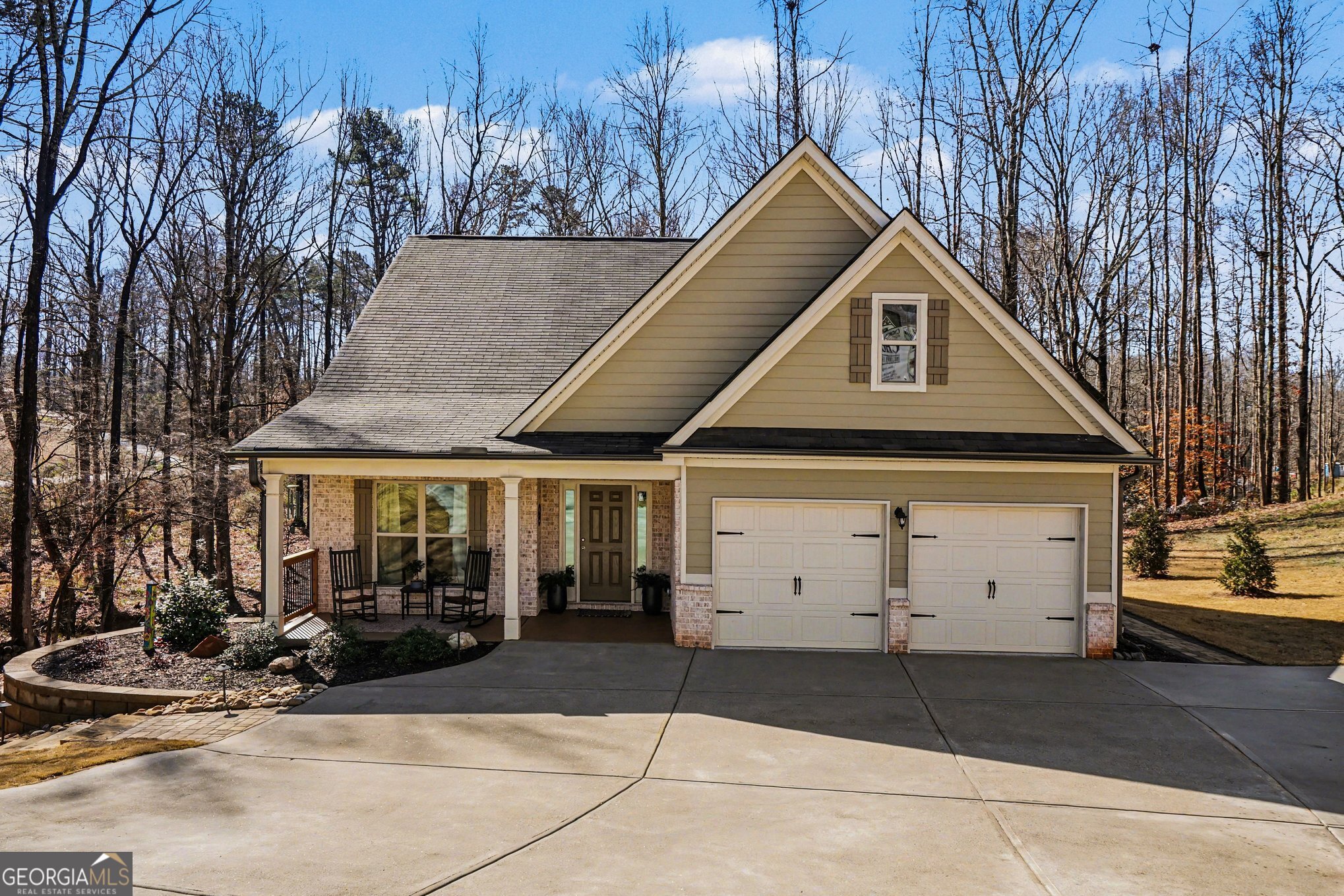a front view of a house with a garage