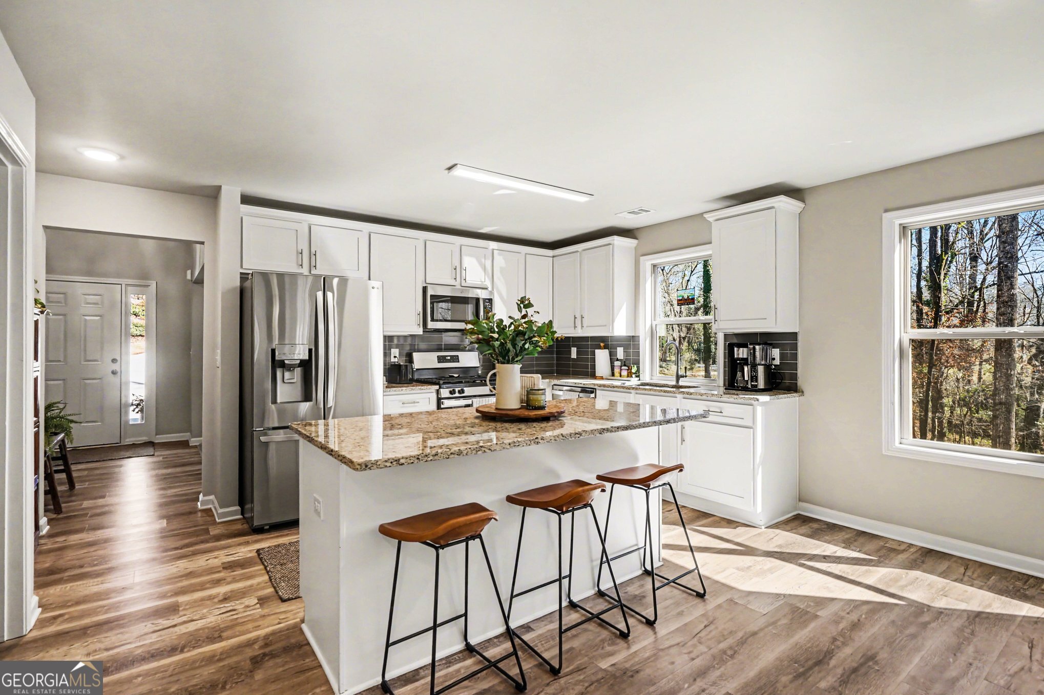 994 Lakeview Drive Commerce, GA 30529 - Photo 13 of 42 a kitchen with stainless steel appliances granite countertop a refrigerator and a stove top oven