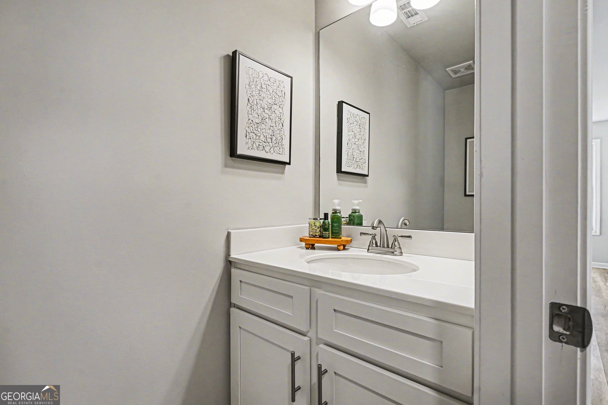 994 Lakeview Drive Commerce, GA 30529 - Photo 16 of 42 a bathroom with a sink and a mirror