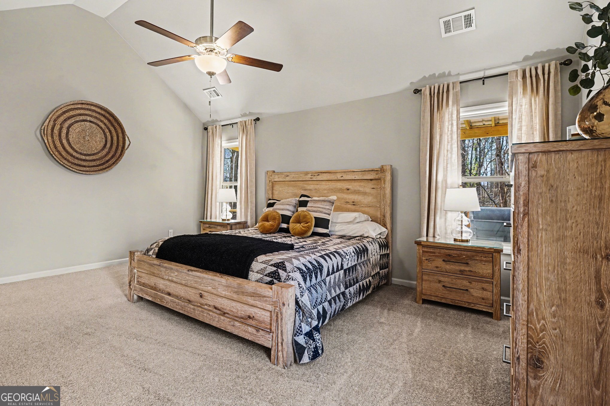 994 Lakeview Drive Commerce, GA 30529 - Photo 18 of 42 a bedroom with a bed and a chandelier