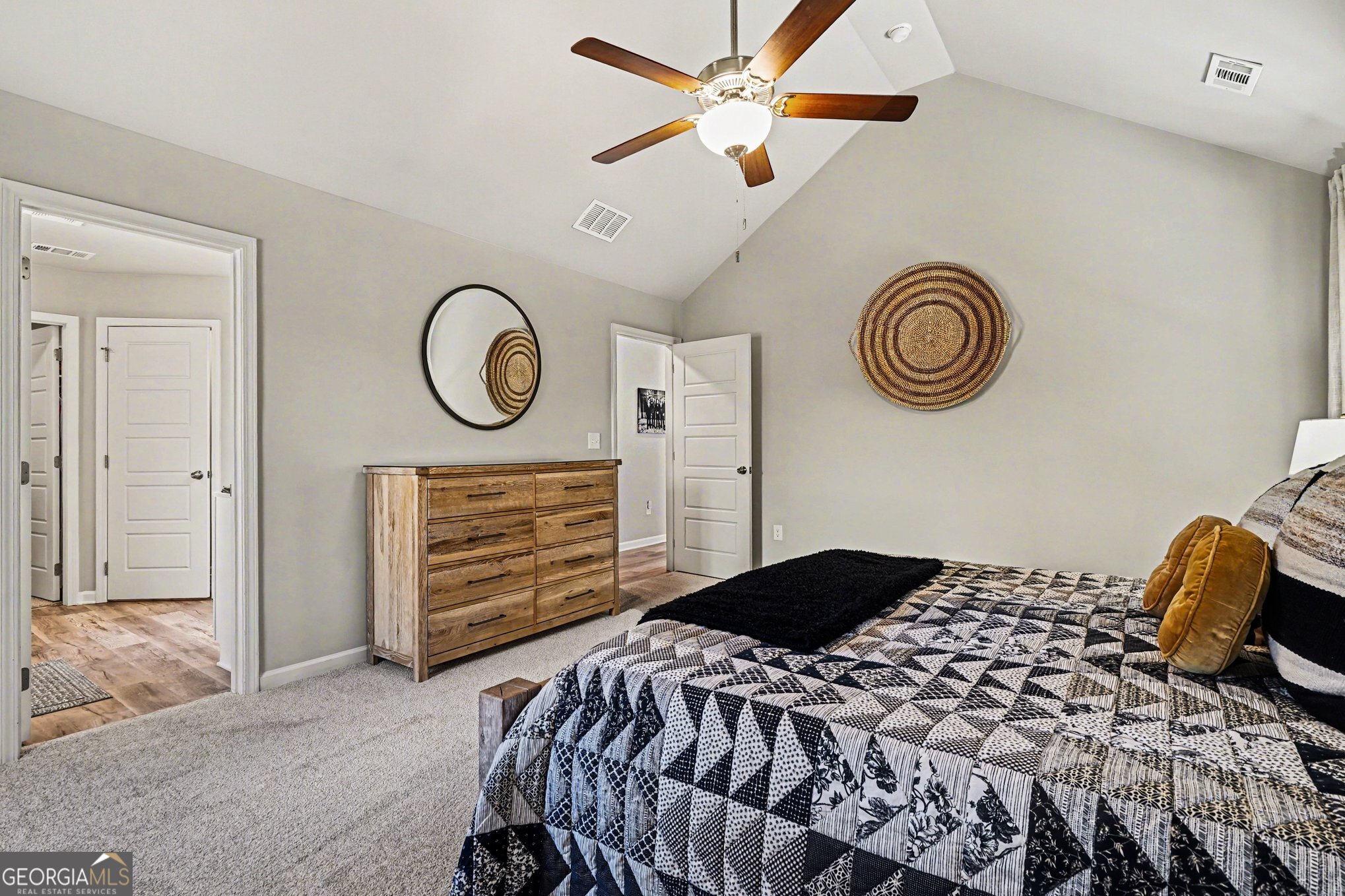 994 Lakeview Drive Commerce, GA 30529 - Photo 20 of 42 a bedroom with a bed and a chandelier