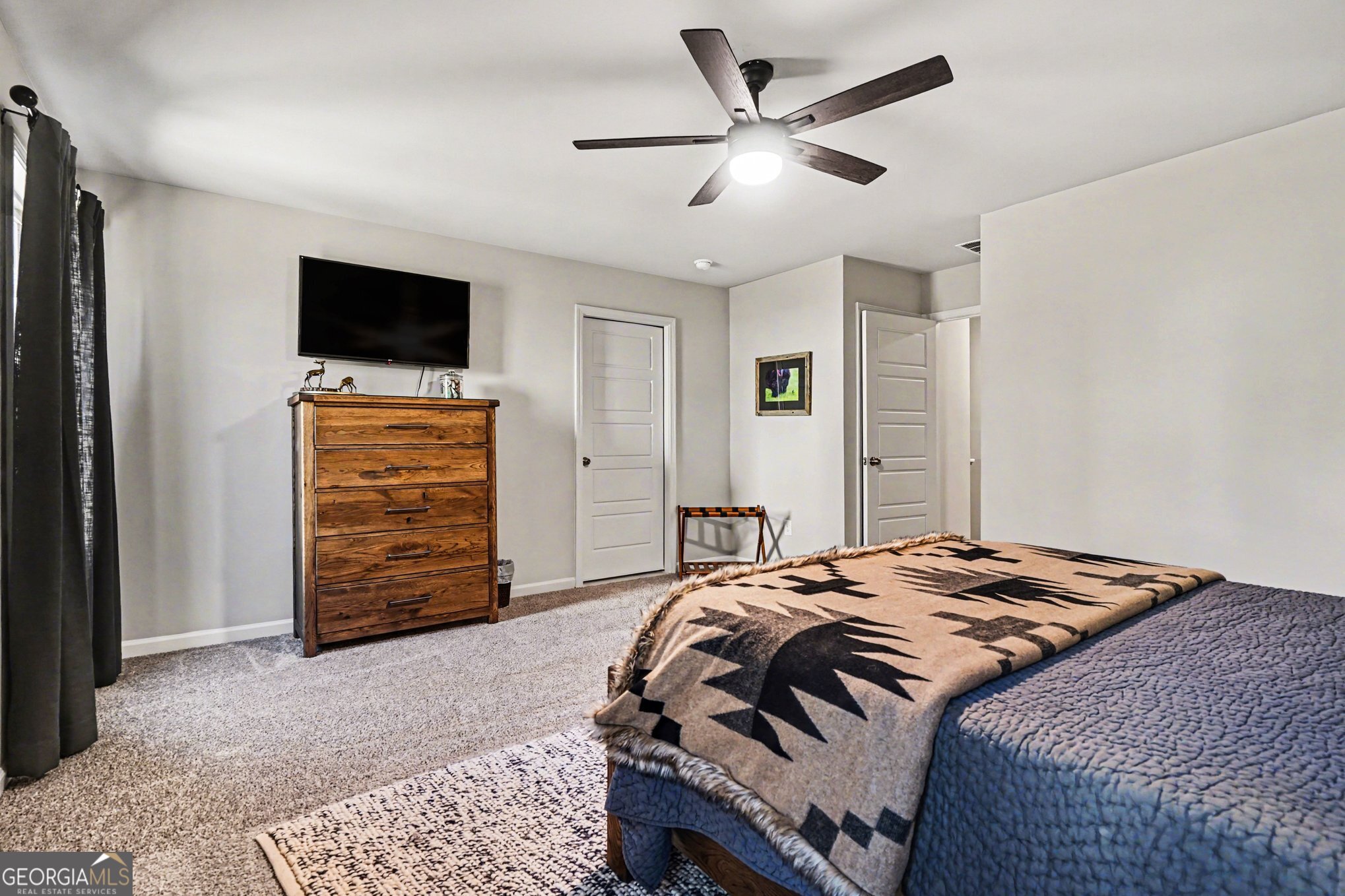 994 Lakeview Drive Commerce, GA 30529 - Photo 28 of 42 a bedroom with a bed and a television