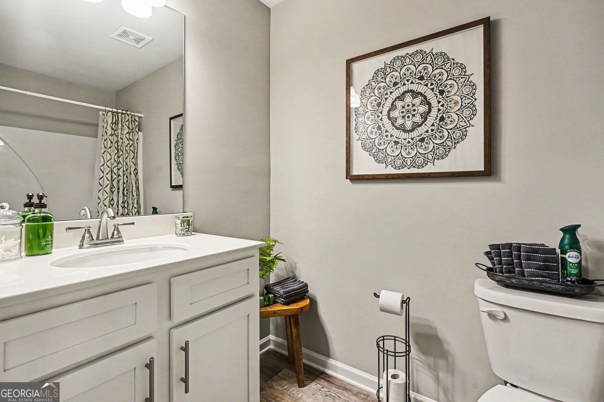994 Lakeview Drive Commerce, GA 30529 - Photo 29 of 42 a bathroom with a sink mirror vanity and toilet