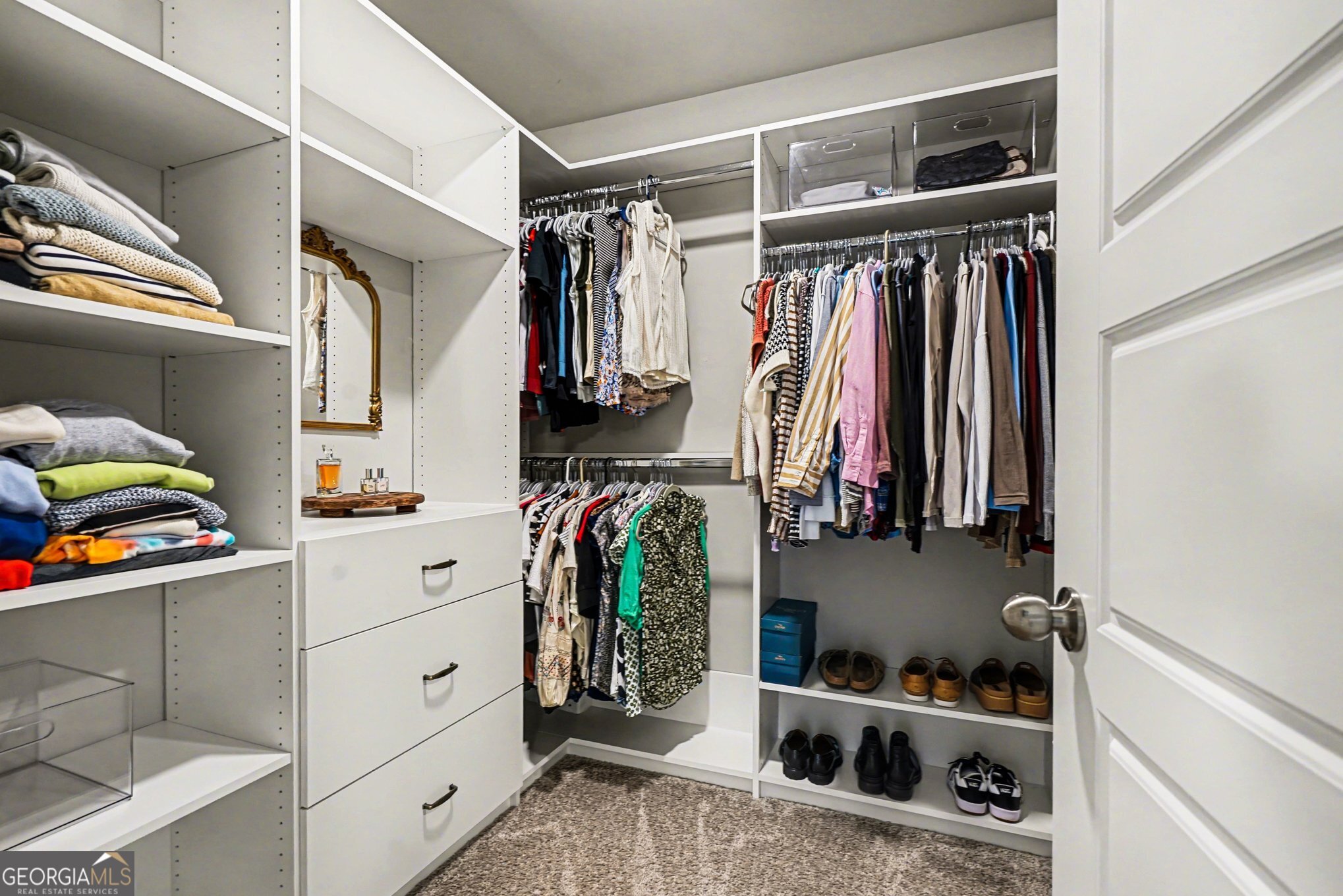 994 Lakeview Drive Commerce, GA 30529 - Photo 32 of 42 a view of walk in closet with clothes and shoes