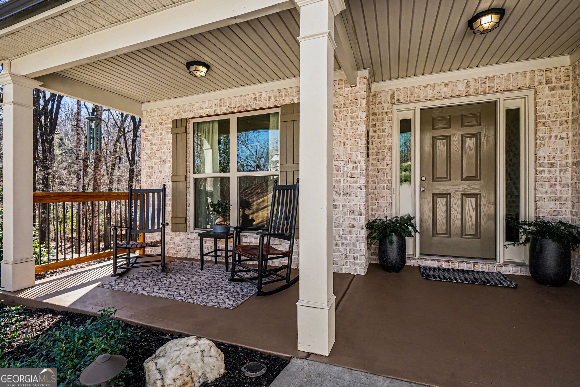 994 Lakeview Drive Commerce, GA 30529 - Photo 4 of 42 a view of a porch with chairs and floor to ceiling window