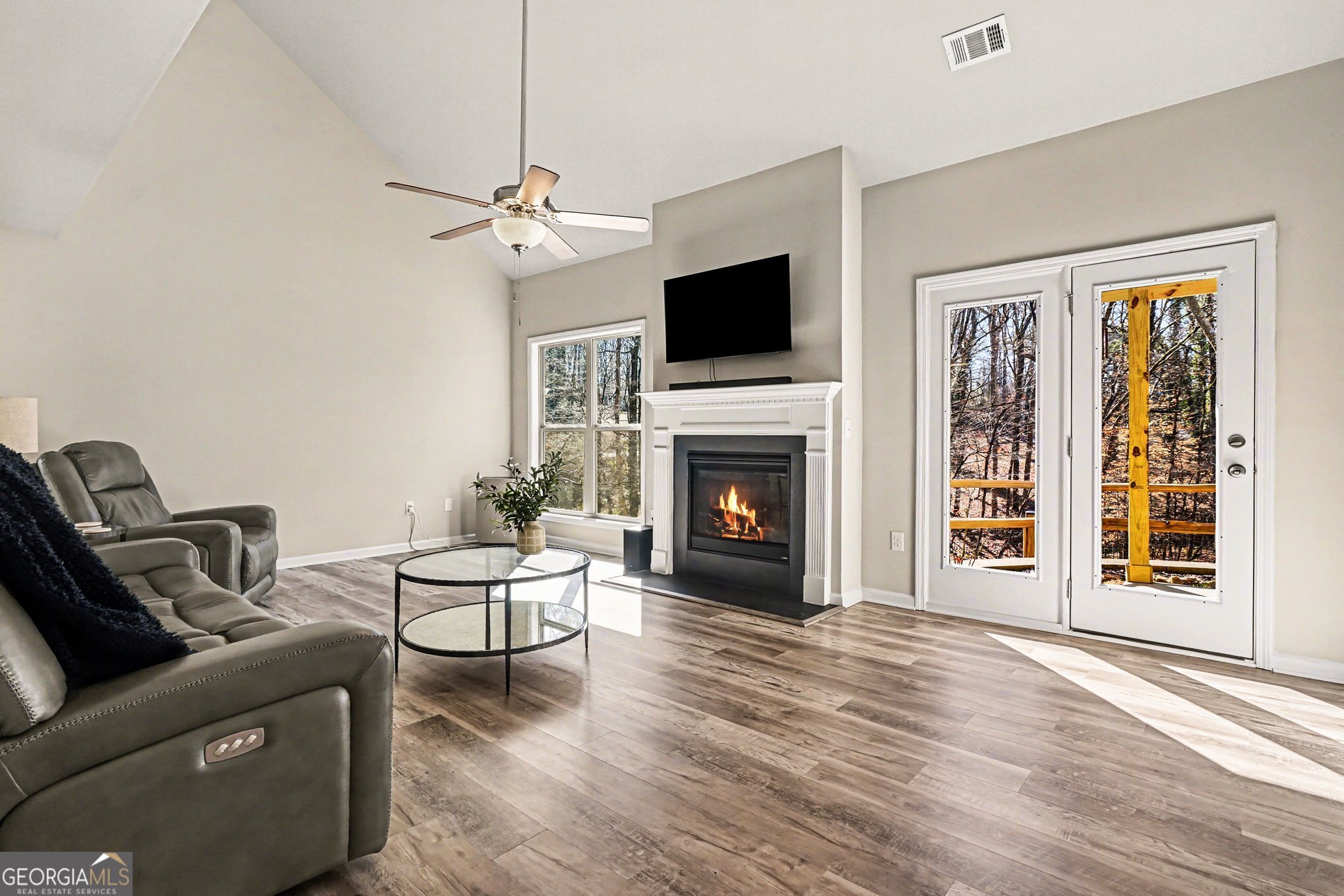 994 Lakeview Drive Commerce, GA 30529 - Photo 7 of 42 a living room with furniture and a fireplace