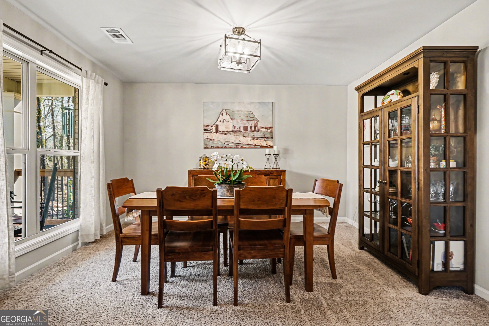 994 Lakeview Drive Commerce, GA 30529 - Photo 10 of 42 a view of a dining room with furniture and a window