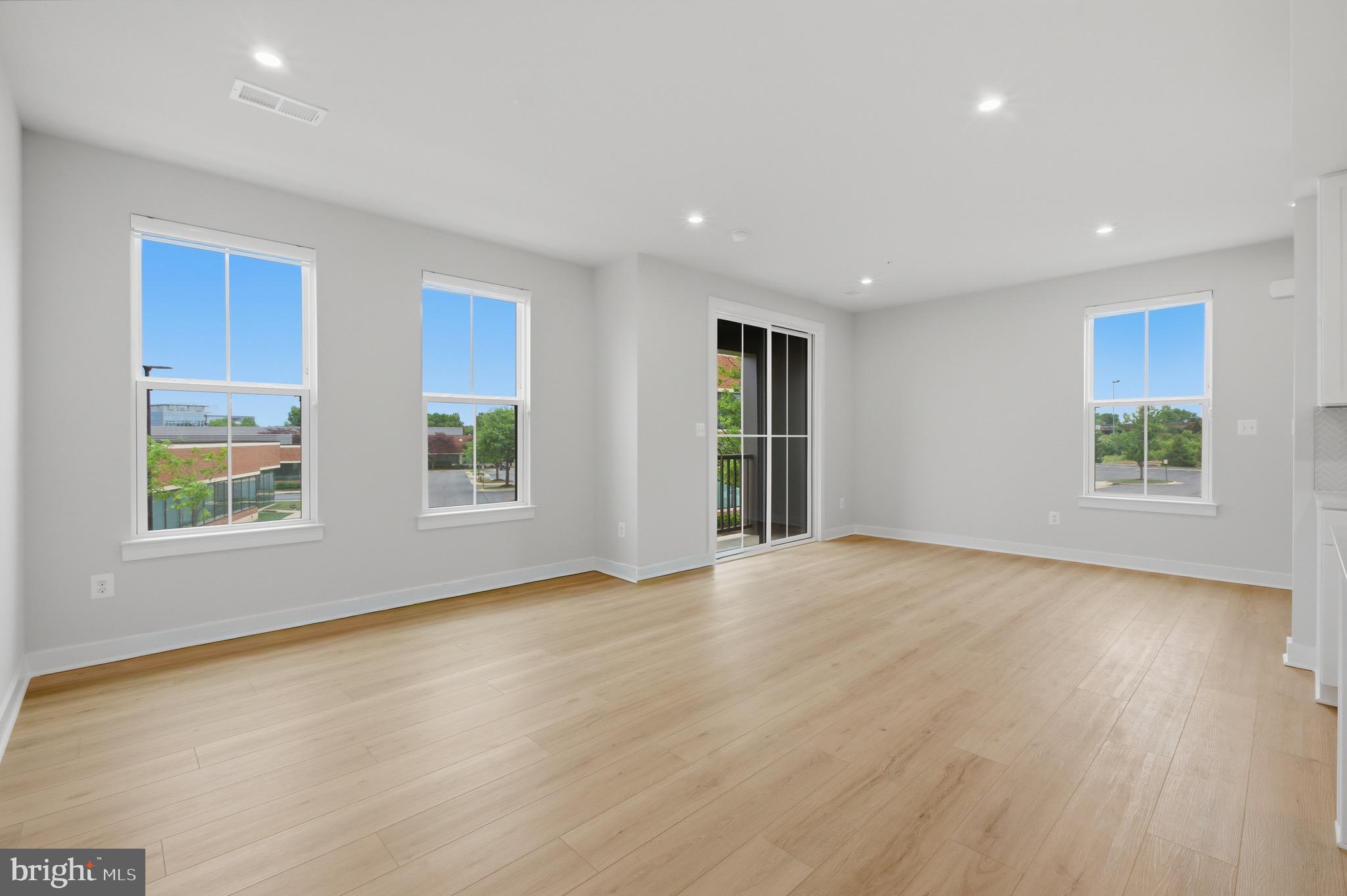 14421 Albemarle Point Place Chantilly, VA 20151 - Photo 12 of 25 a view of an empty room with a window and wooden floor