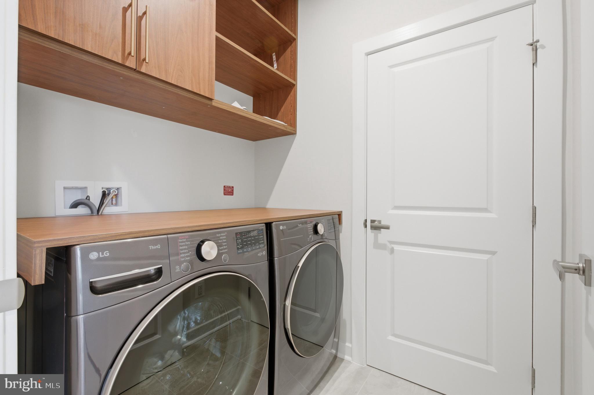 14421 Albemarle Point Place Chantilly, VA 20151 - Photo 15 of 25 a utility room with dryer and washer