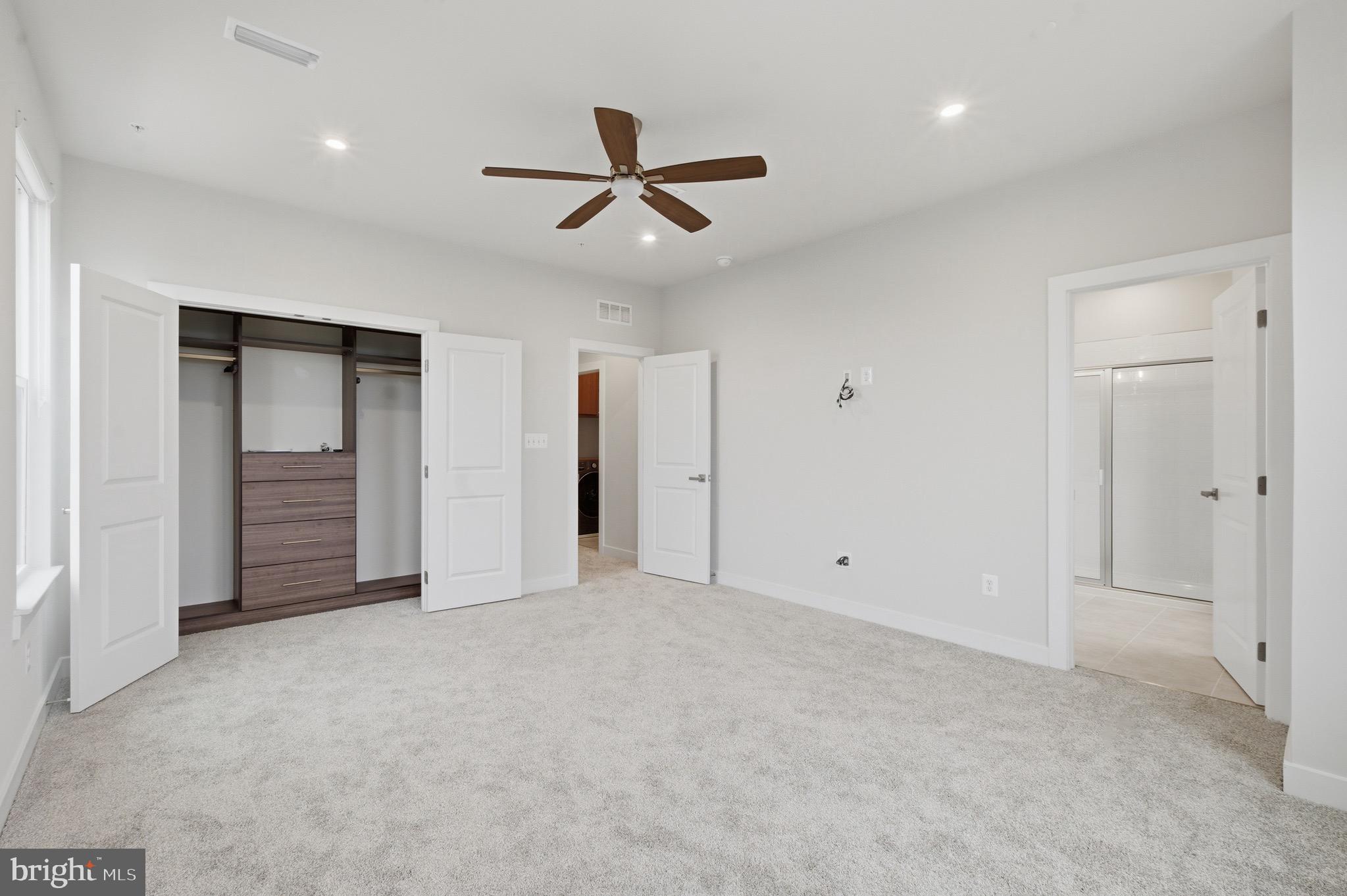 14421 Albemarle Point Place Chantilly, VA 20151 - Photo 17 of 25 an empty room with closet and windows