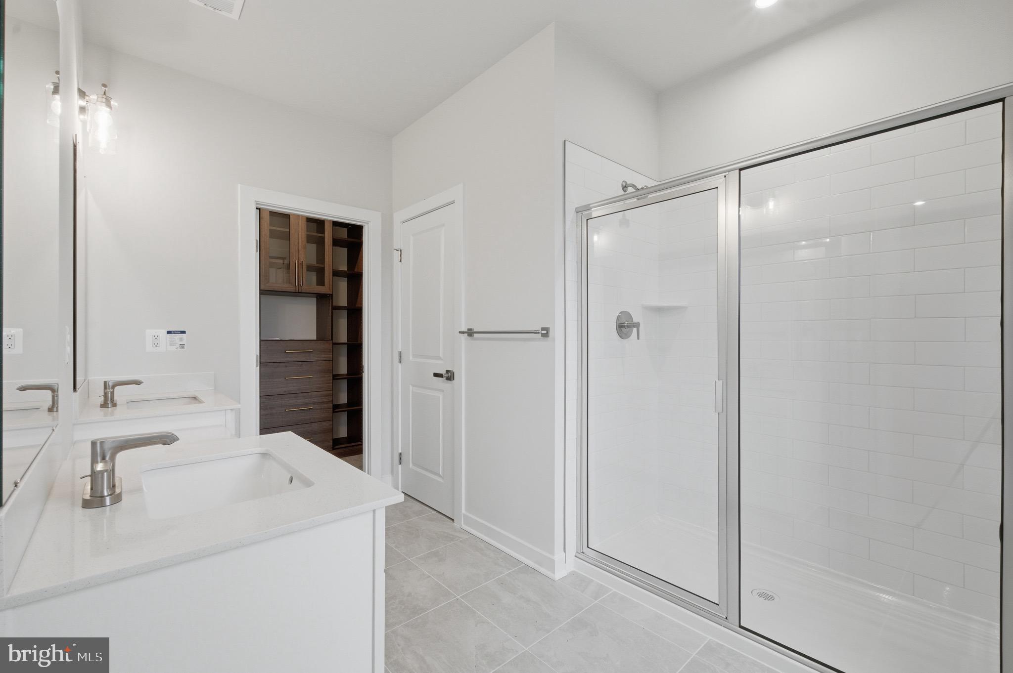 14421 Albemarle Point Place Chantilly, VA 20151 - Photo 18 of 25 a bathroom with a sink and a mirror