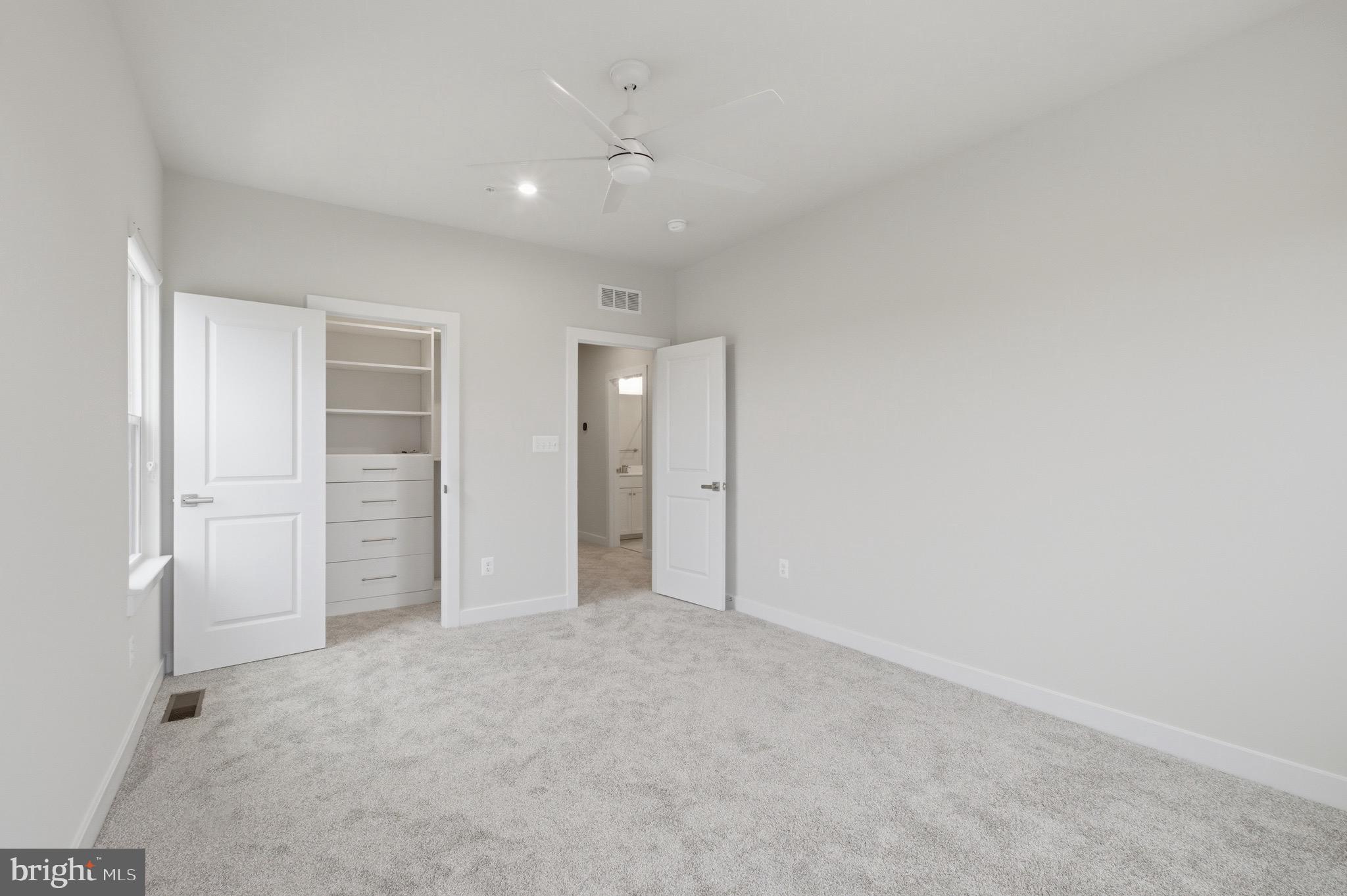 14421 Albemarle Point Place Chantilly, VA 20151 - Photo 22 of 25 an empty room with closet and bathroom