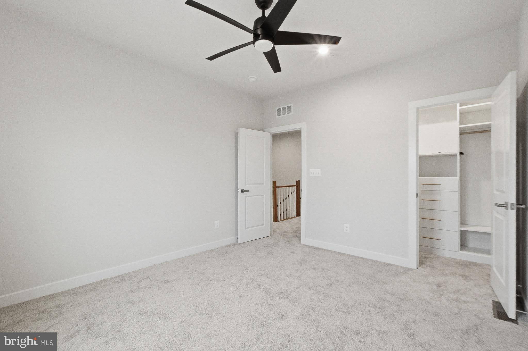 14421 Albemarle Point Place Chantilly, VA 20151 - Photo 24 of 25 an empty room with closet and a ceiling fan