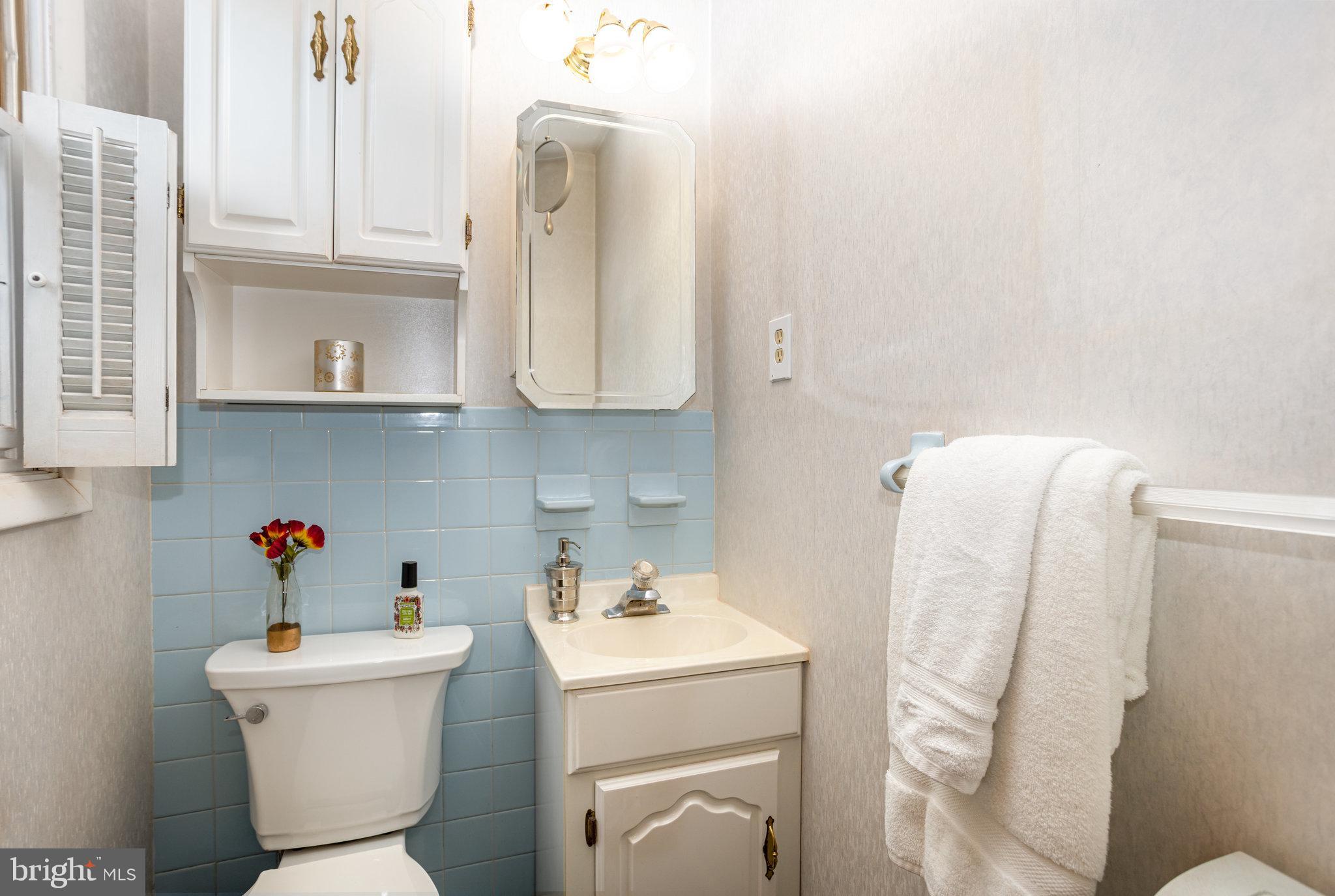 32 Bishop Road Mechanicsburg, PA 17055 - Photo 11 of 31 a bathroom with a sink a toilet and curtain