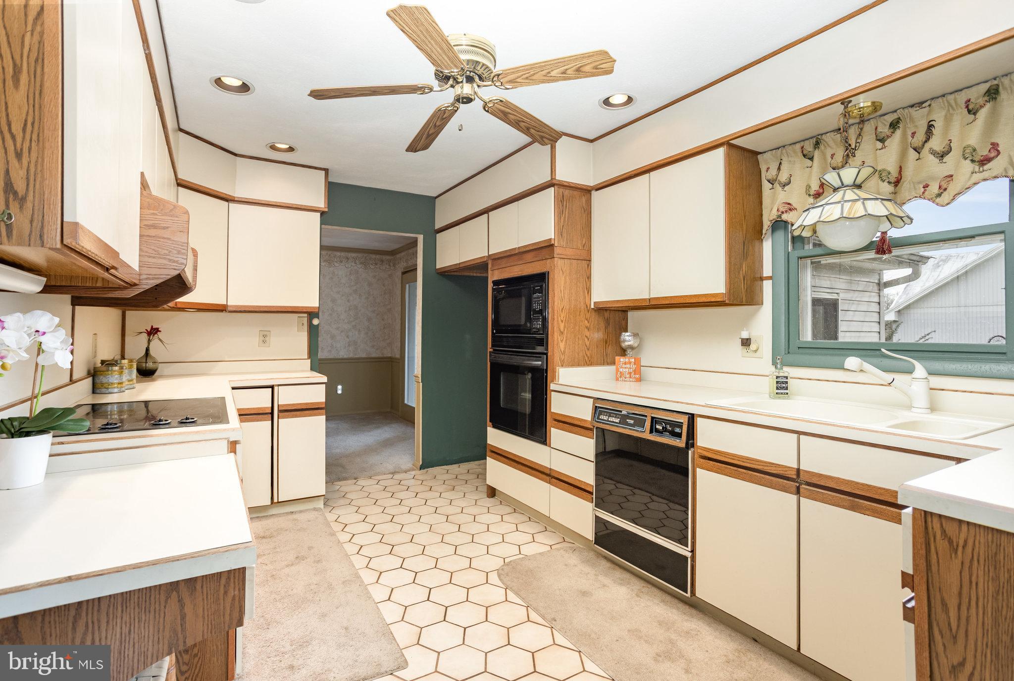 32 Bishop Road Mechanicsburg, PA 17055 - Photo 5 of 31 a kitchen with stainless steel appliances kitchen island granite countertop a sink and cabinets