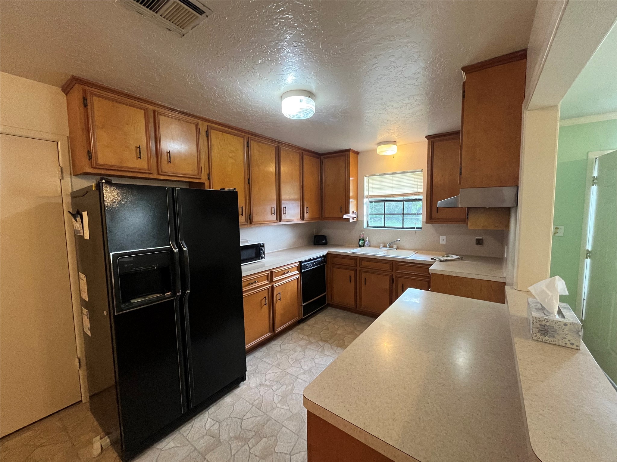 1475 Cr 16 Road Garwood, TX 77442 - Photo 20 of 43 a kitchen with stainless steel appliances a refrigerator sink and cabinets
