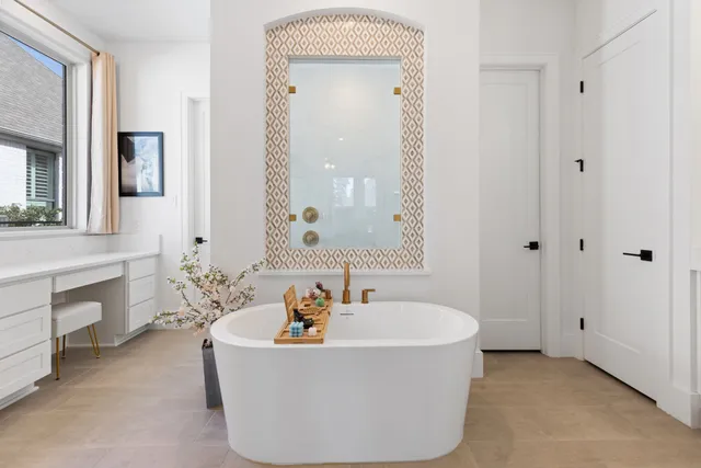 a white bath tub sitting in a bathroom