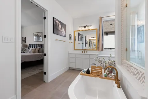 a bathroom with sink a mirror and vanity