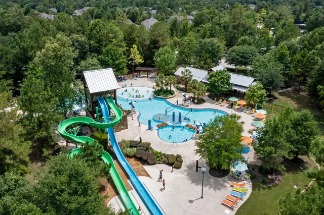an aerial view of a chairs and table on the wall