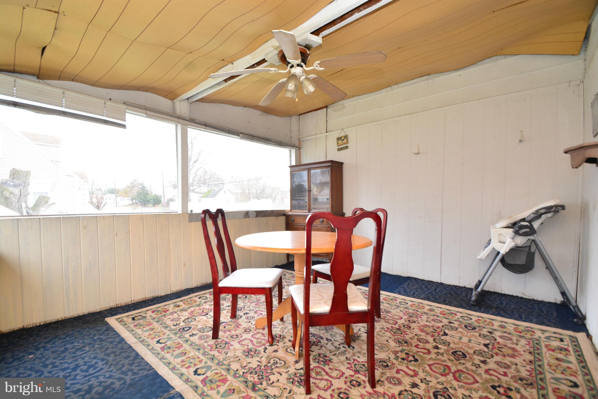 344 Poplar Road Baltimore, MD 21221 - Photo 22 of 23 a dining room with furniture and window