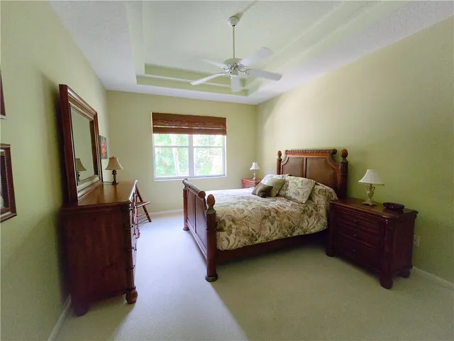a bedroom with bed and window