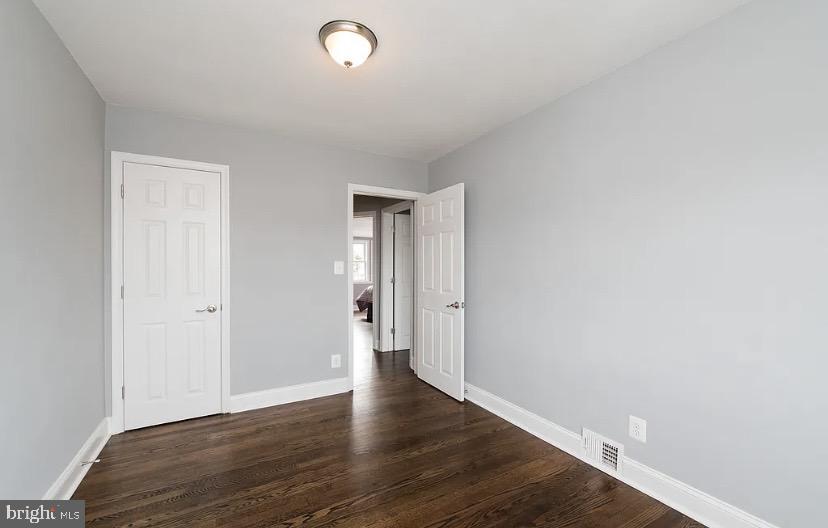 1224 Winston Avenue Baltimore, MD 21239 - Photo 19 of 26 a view of an empty room with wooden floor