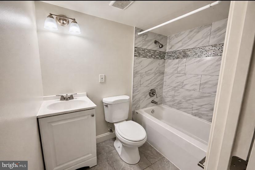1224 Winston Avenue Baltimore, MD 21239 - Photo 24 of 26 a bathroom with a sink a toilet and shower