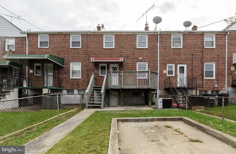 1224 Winston Avenue Baltimore, MD 21239 - Photo 26 of 26 a front view of a house with garden