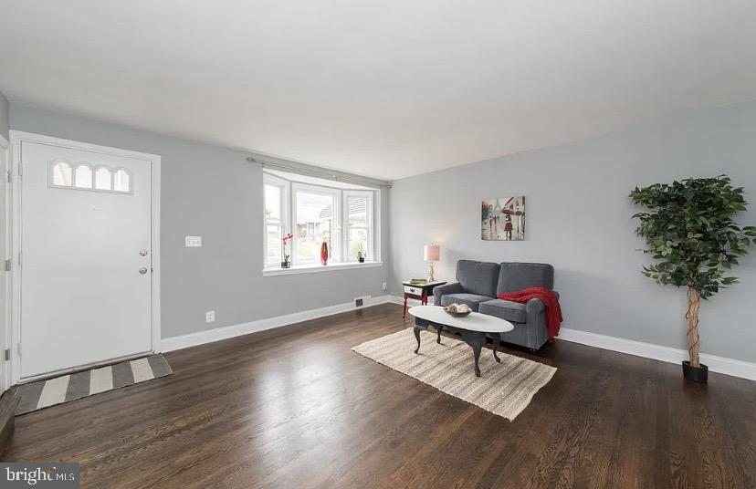 1224 Winston Avenue Baltimore, MD 21239 - Photo 3 of 26 a living room with furniture and a potted plant