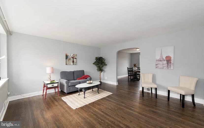 1224 Winston Avenue Baltimore, MD 21239 - Photo 4 of 26 a living room with furniture and a wooden floor