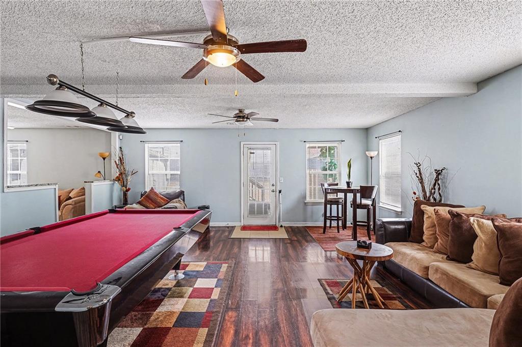 11811 Registry Boulevard Hampton, GA 30228 - Photo 17 of 33 a bedroom with furniture and wooden floor