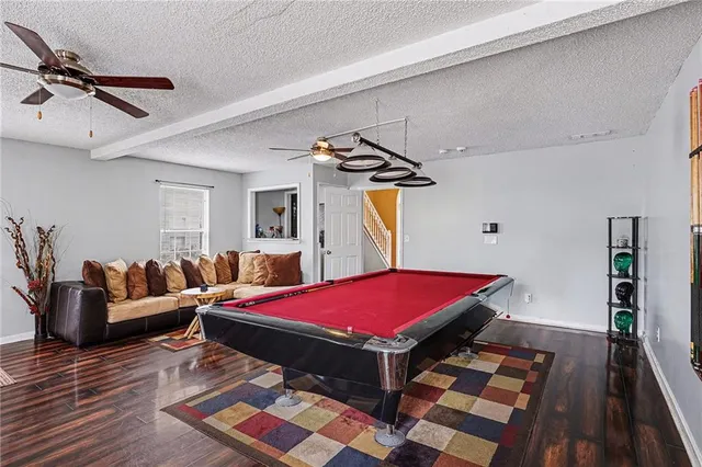 a view of a living room and a wooden floor