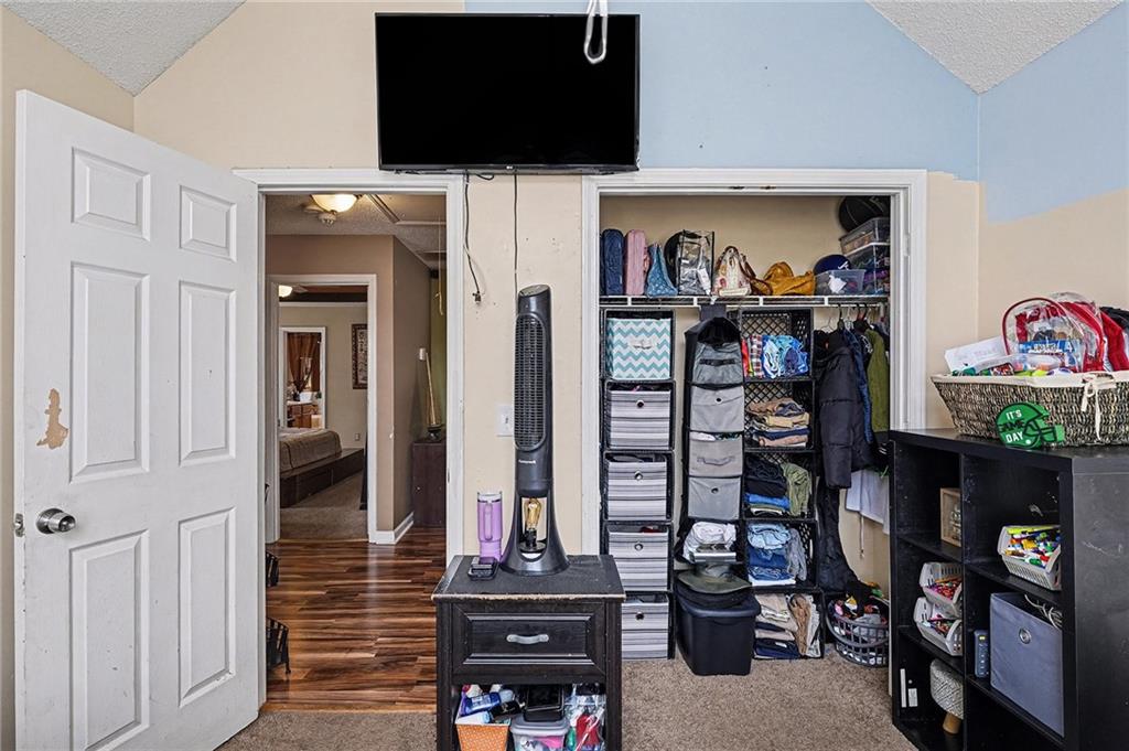 11811 Registry Boulevard Hampton, GA 30228 - Photo 26 of 33 a view of a living room with clothes and shoes