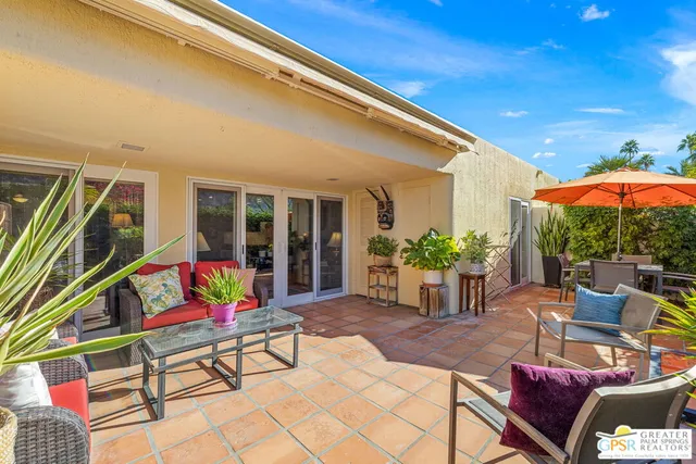 a backyard of a house with seating space