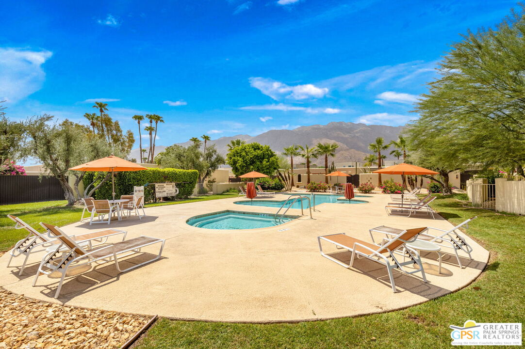 1115 East Alejo Road Palm Springs, CA 92262 - Photo 12 of 40 a view of a swimming pool with a patio