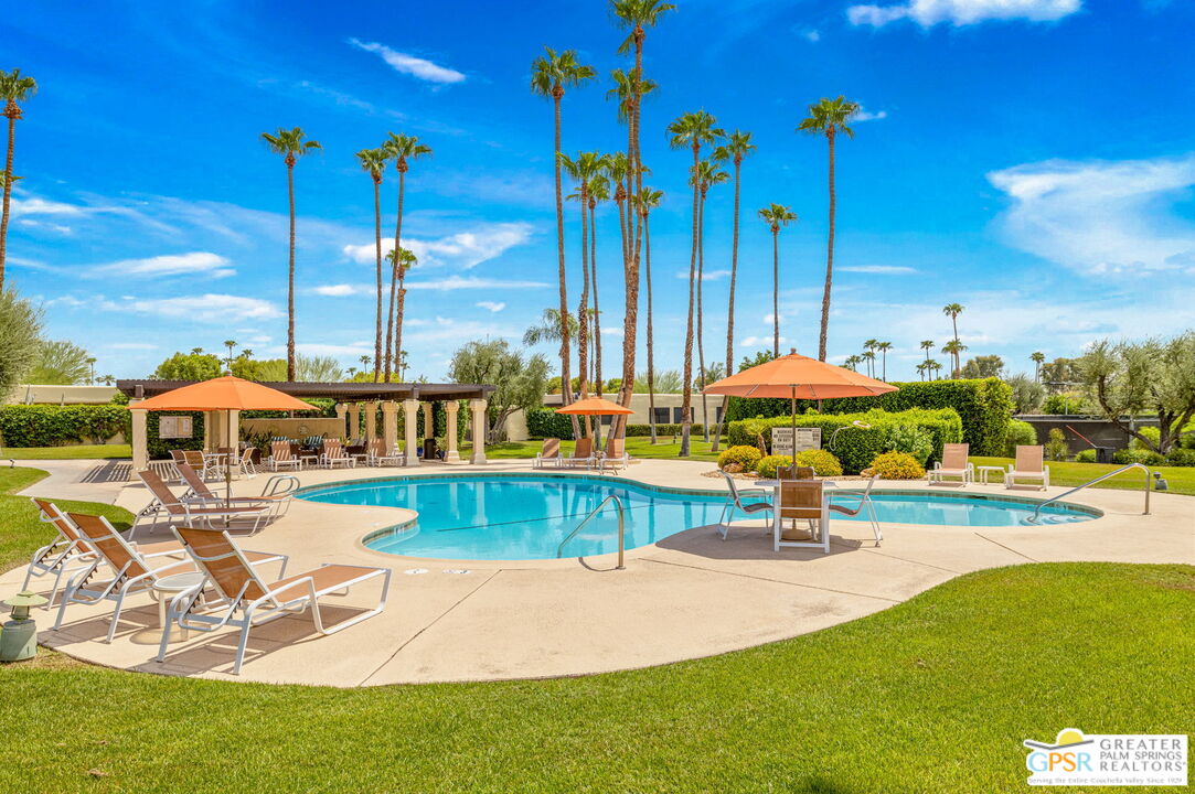 1115 East Alejo Road Palm Springs, CA 92262 - Photo 13 of 40 a view of a swimming pool with a patio