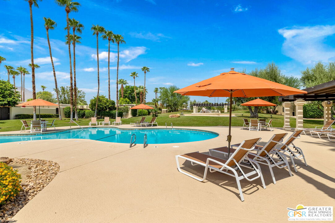 1115 East Alejo Road Palm Springs, CA 92262 - Photo 14 of 40 a patio with a yard table and chairs