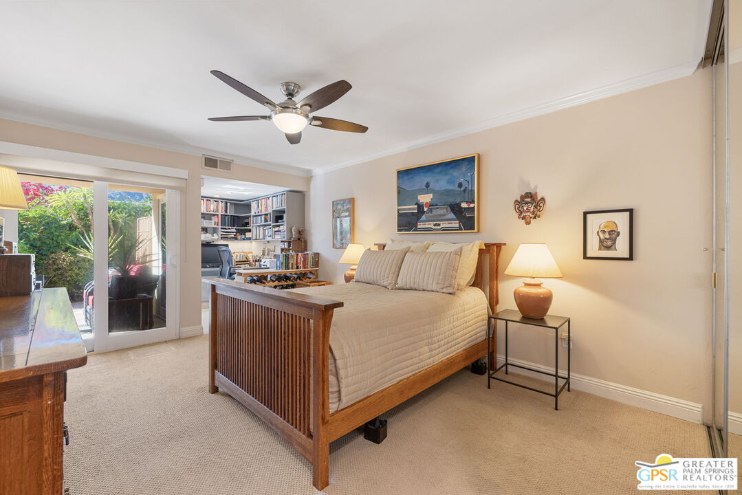 1115 East Alejo Road Palm Springs, CA 92262 - Photo 25 of 40 a bed room with a bed and a chandelier