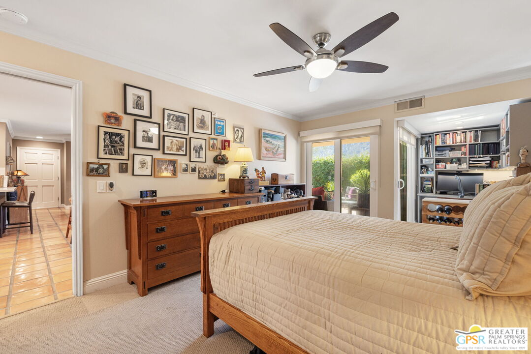 1115 East Alejo Road Palm Springs, CA 92262 - Photo 26 of 40 a bedroom with a large bed and a large window
