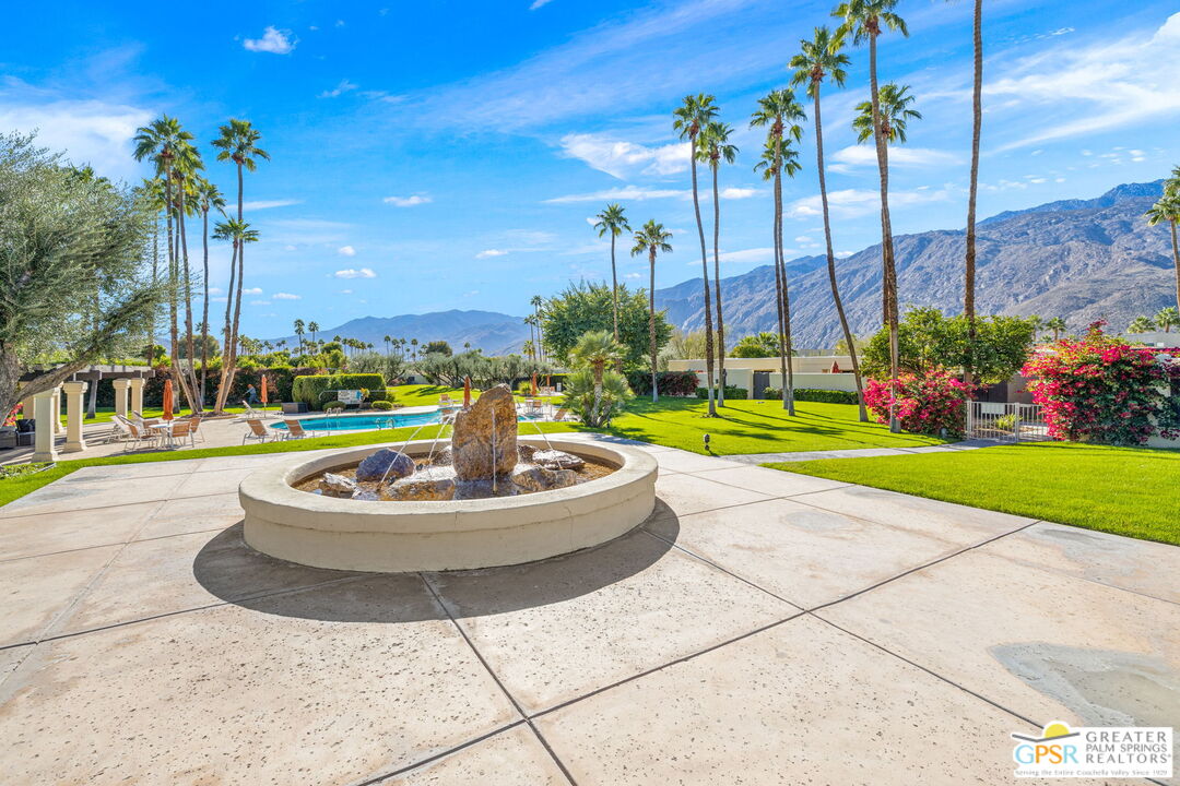 1115 East Alejo Road Palm Springs, CA 92262 - Photo 37 of 40 a building view with a garden space