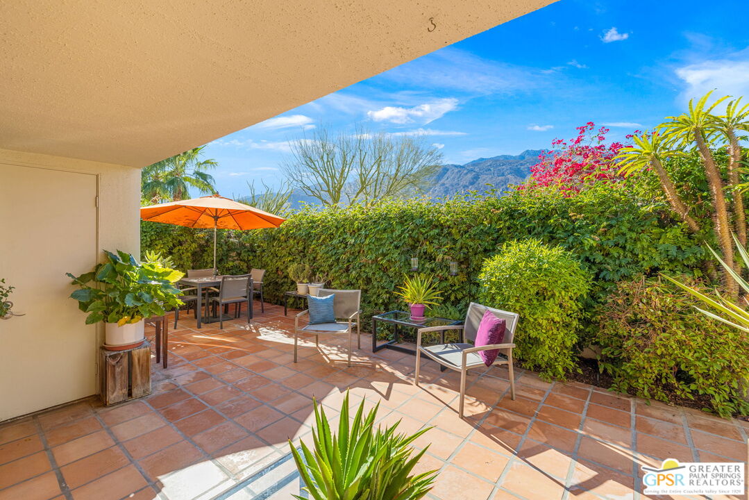 1115 East Alejo Road Palm Springs, CA 92262 - Photo 8 of 40 a patio with table and chairs