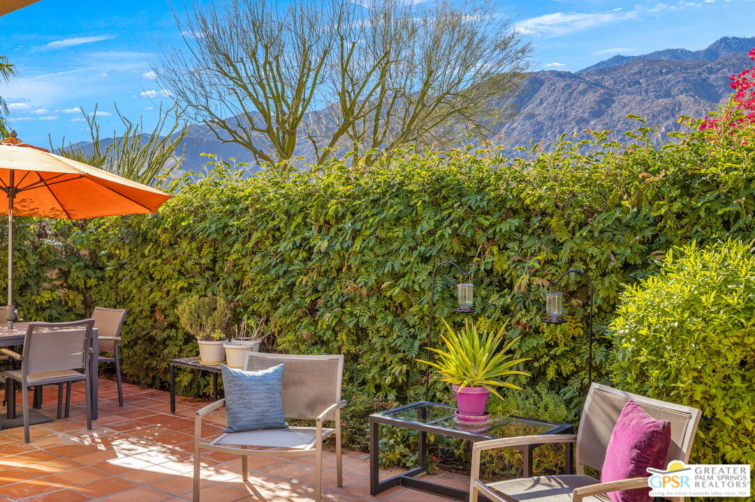 1115 East Alejo Road Palm Springs, CA 92262 - Photo 9 of 40 a backyard of a house with table and chairs