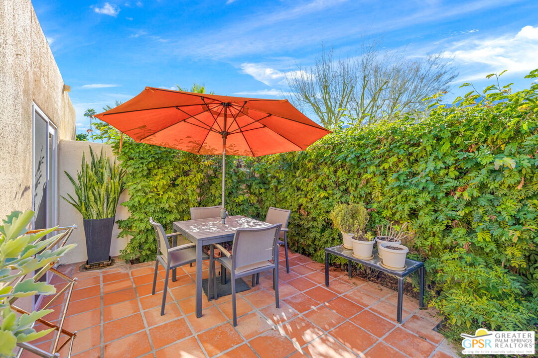 1115 East Alejo Road Palm Springs, CA 92262 - Photo 10 of 40 an outdoor space with furniture and umbrella