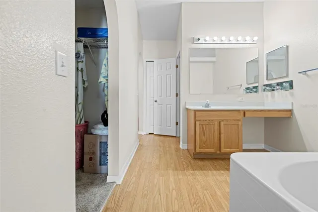 a view of a room with wooden floor