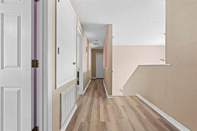 a front view of a house with large garden