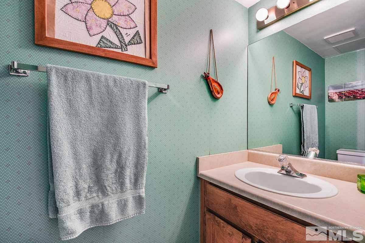 1635 Peavine Road Reno, NV 89503 - Photo 13 of 25 a bathroom with a sink and a mirror