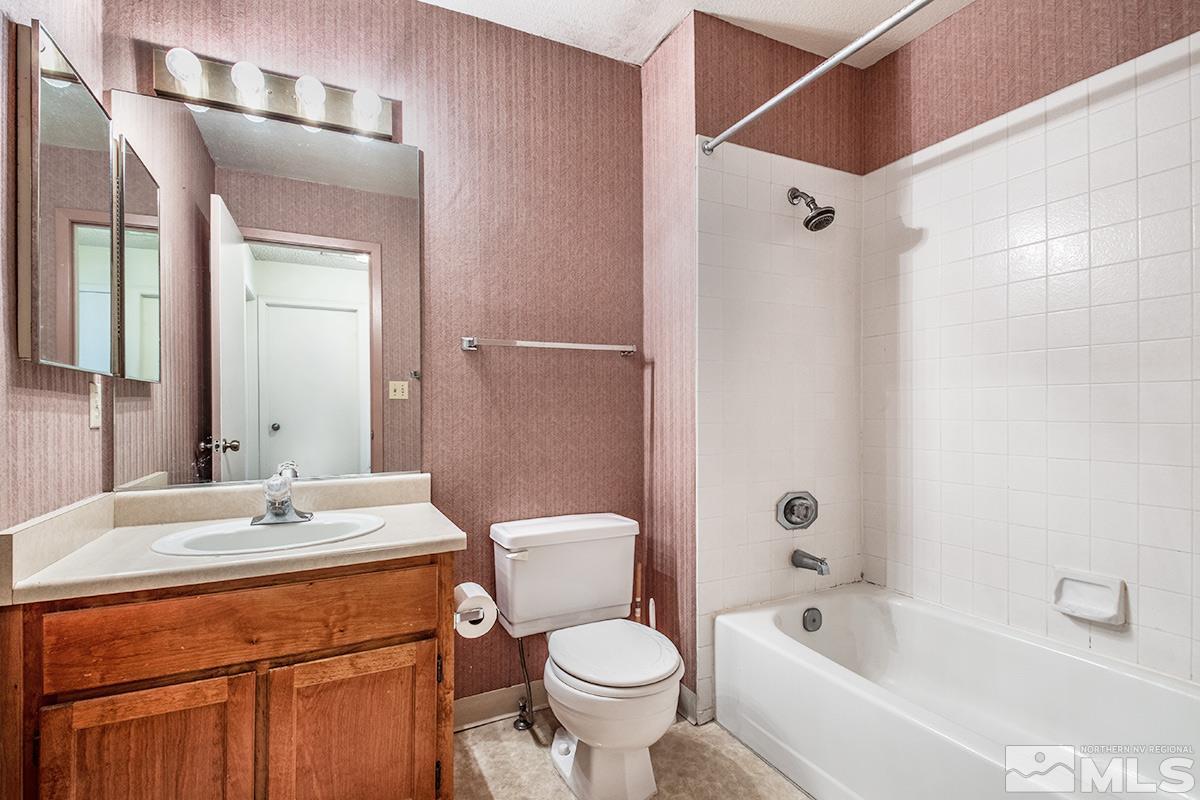 1635 Peavine Road Reno, NV 89503 - Photo 19 of 25 a bathroom with a sink toilet and shower