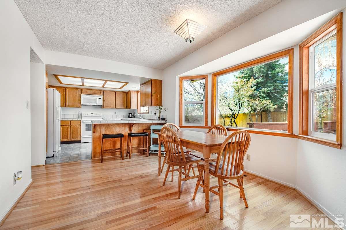 1635 Peavine Road Reno, NV 89503 - Photo 8 of 25 a view of a dining room with furniture and wooden floor