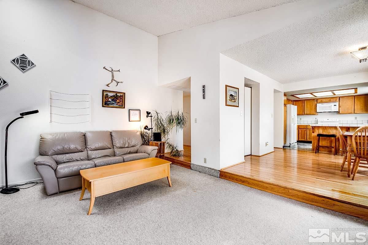 1635 Peavine Road Reno, NV 89503 - Photo 9 of 25 a living room with furniture and a table with wooden floor